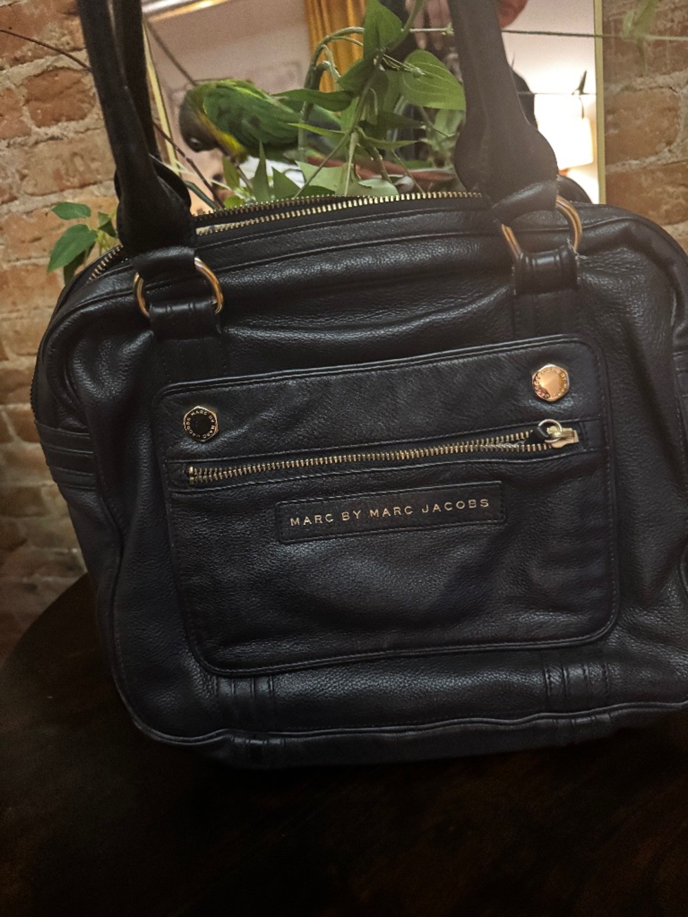 Marc by Marc Jacobs pebbled leather shoulder handbag in black.